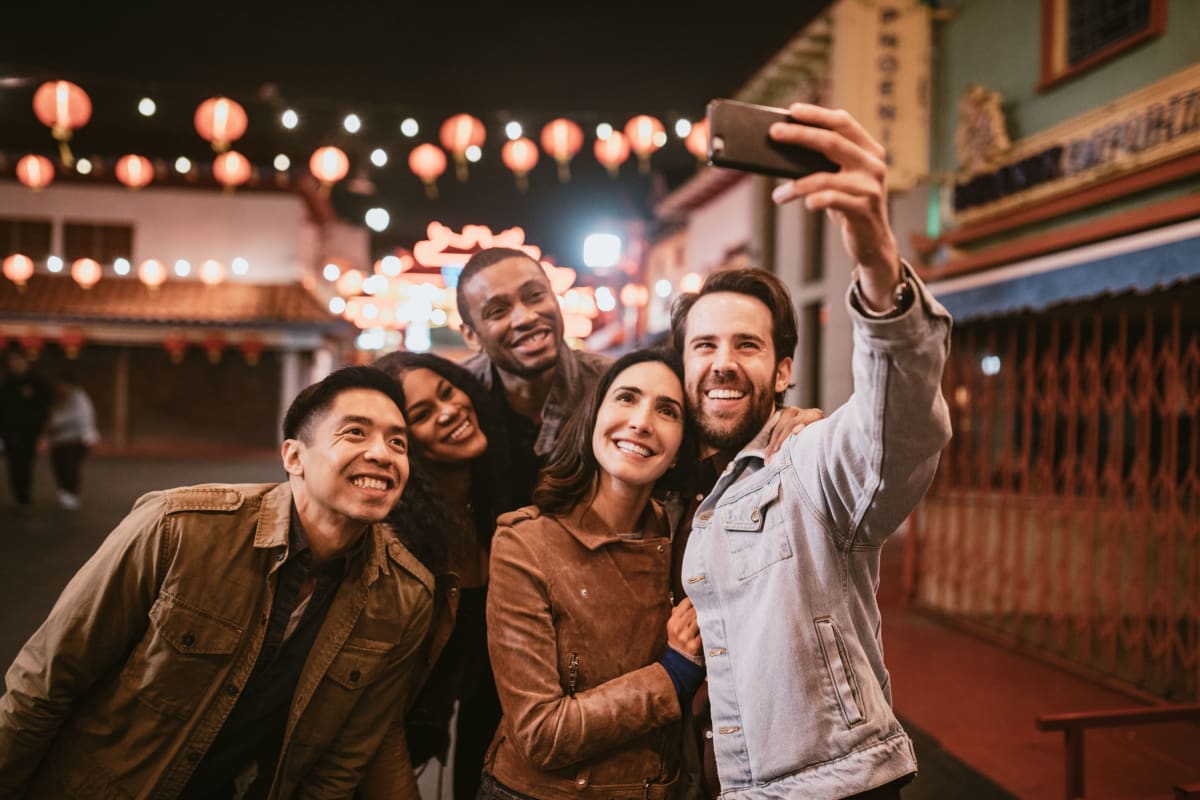 Friends taking a selfie near Satyr Hill Apartments in Parkville, Maryland