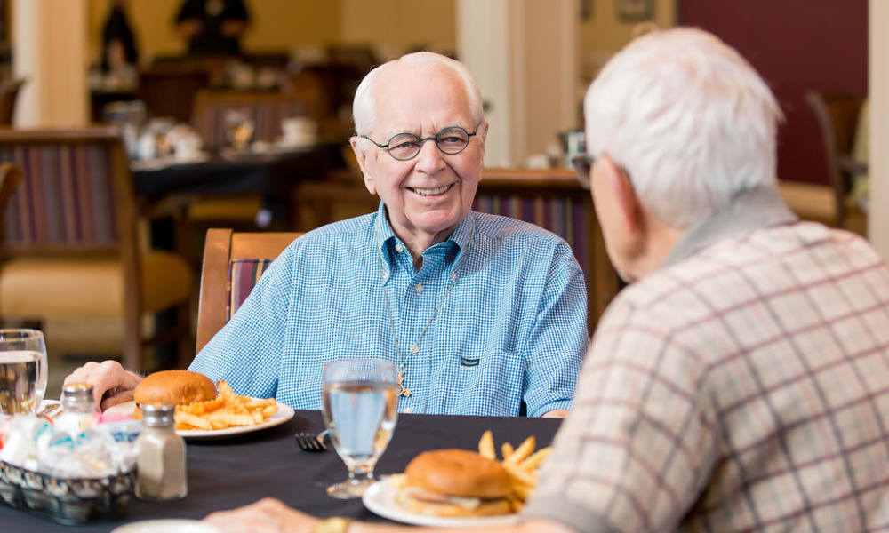 Two residents eating together at Touchmark at Pilot Butte in Bend, Oregon
