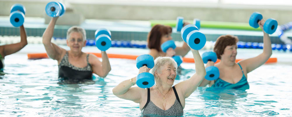 Residents engaged in a group swimming exercise at The Springs at The Waterfront in Vancouver, Washington