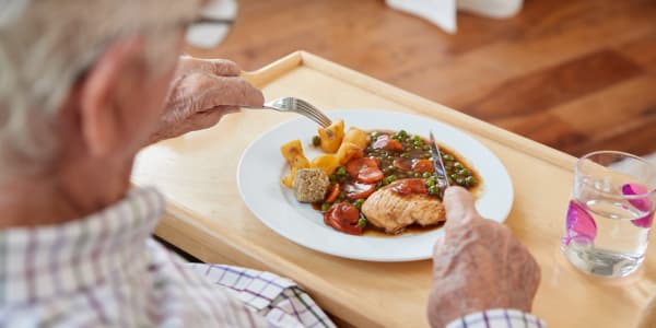 Resident eating a delicious and healthy meal at Retirement Ranch in Clovis, New Mexico