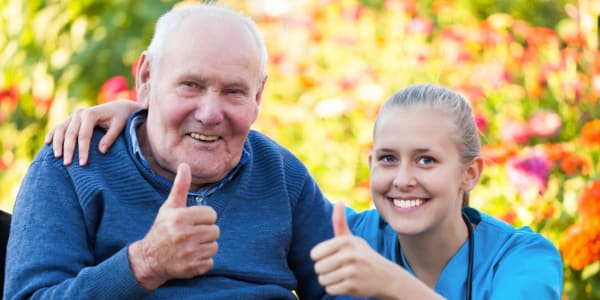 Resident and nurse giving a thumbs up at Retirement Ranch in Clovis, New Mexico