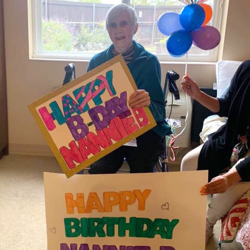 Resident celebrating a birthday at Oxford Glen Memory Care at Sachse in Sachse, Texas
