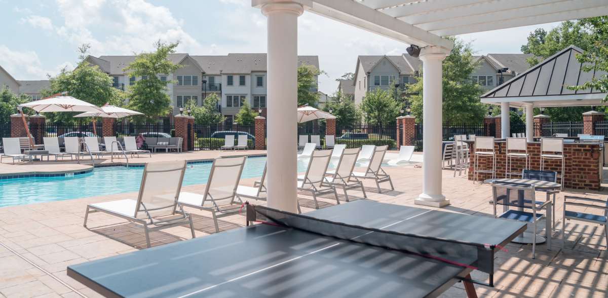 Poolside lounge chairs and ping pong at Meridian Parkside, Newport News, Virginia
