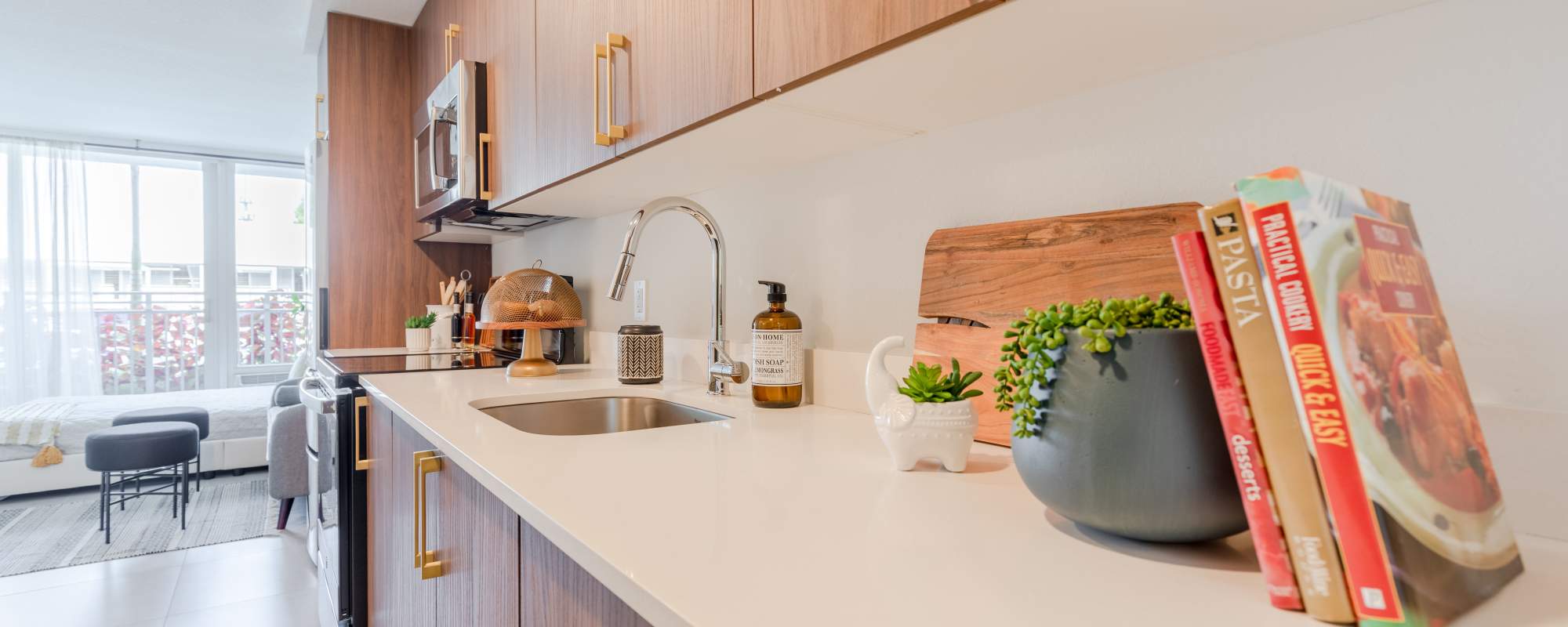 Kitchen room with stainless-steel sink and large windows at  Alture Westland in Hialeah, Florida