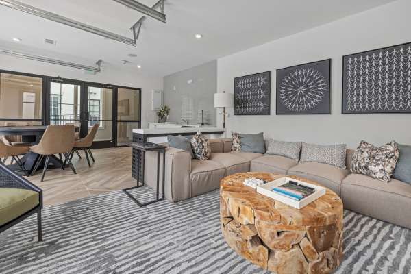 A furnished apartment living room and dining room at The Lowe in Savannah, Georgia