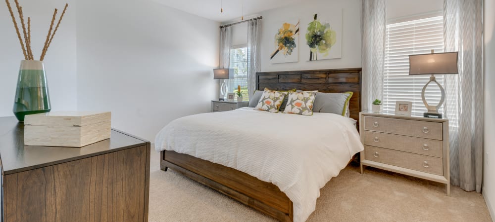 Naturally bright model bedroom at Champions Vue Apartments in Davenport, Florida
