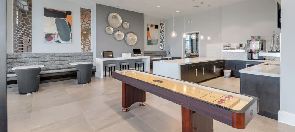 Game room and clubhouse kitchen at Champions Vue Apartments in Davenport, Florida