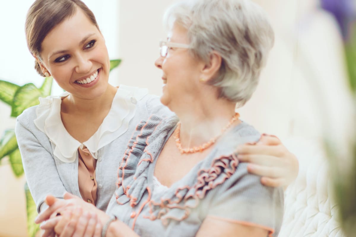 Resident talking with a younger family member at The Commons at Union Ranch in Manteca, California