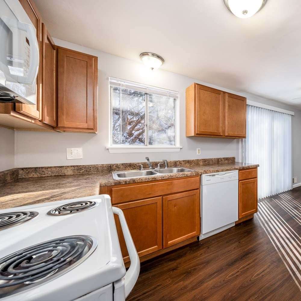 Kitchen area of an apartment home at Fleming Creek & Brookside Townhomes in Rochester, New York