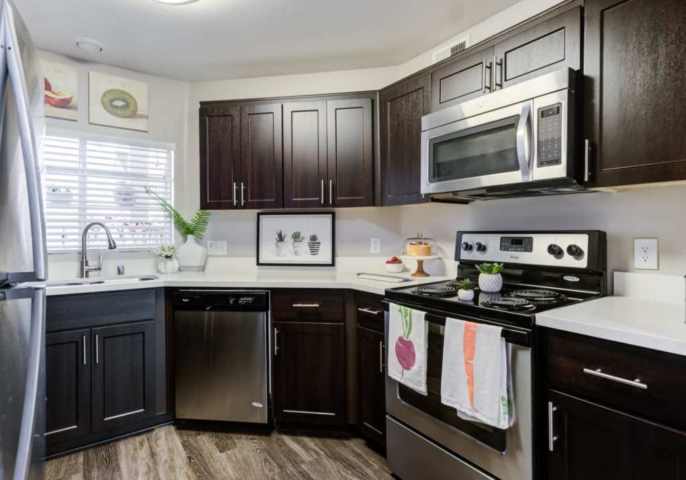 Well-furnished kitchen with wooden cabinets at The Bluffs in Rancho Cucamonga, California