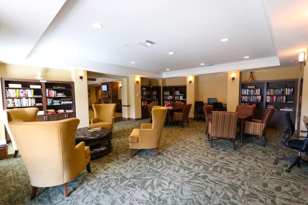 A library with cozy seating at Harmony at Reynolds Mountain in Asheville, North Carolina