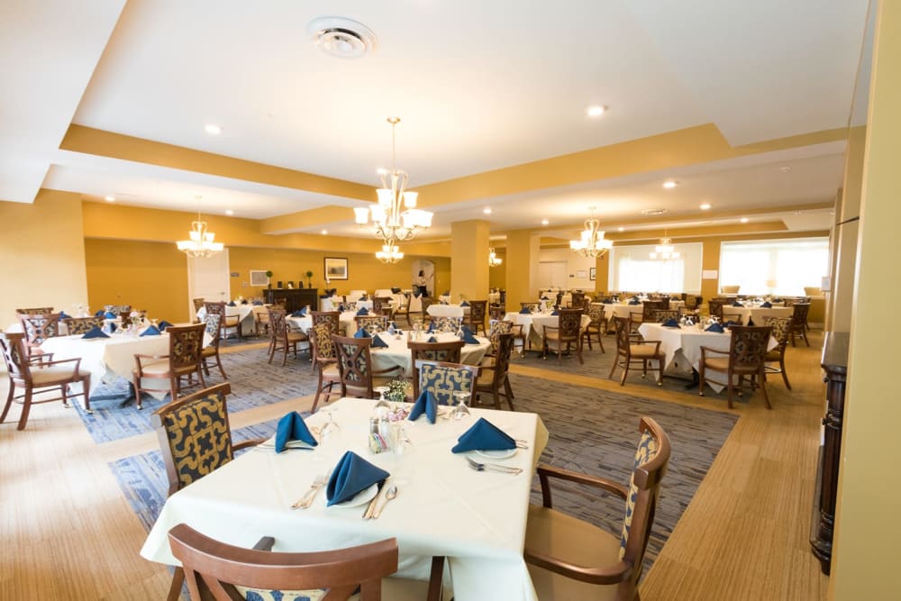 Well decorated dining room tables at Harmony at Independence in Virginia Beach, Virginia