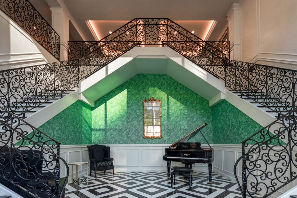 Grand piano at the base of staircases at The Yard At Pencoyd Landing in Bala Cynwyd, Pennsylvania