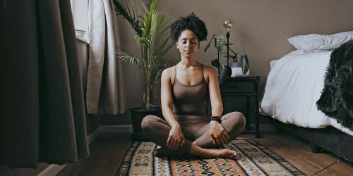 Resident doing yoga at Mountain Breeze Villas in San Bernardino, California