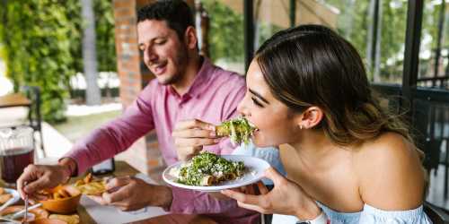 Couple enjoying tacos at outdoor table near The Barstow in Austin, Texas