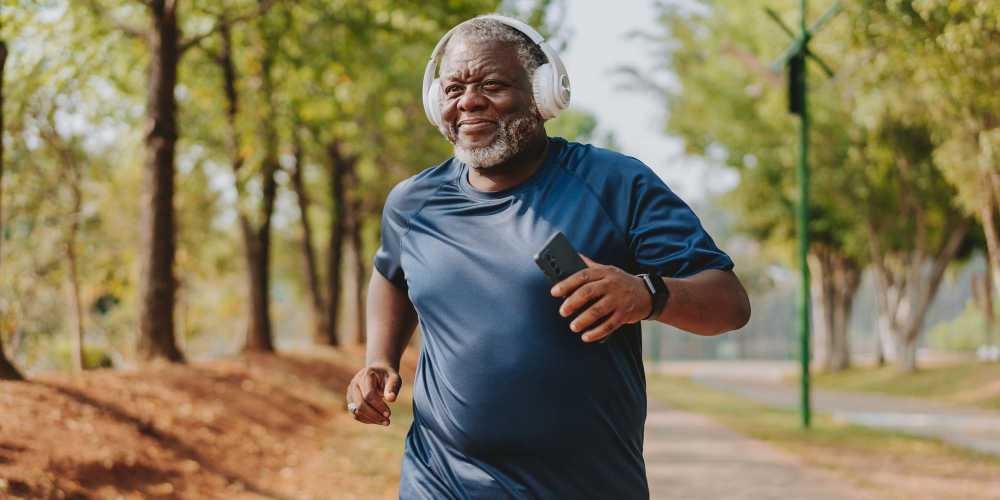 Senior resident jogging at a park near Whitetail Ridge in Salem, Wisconsin