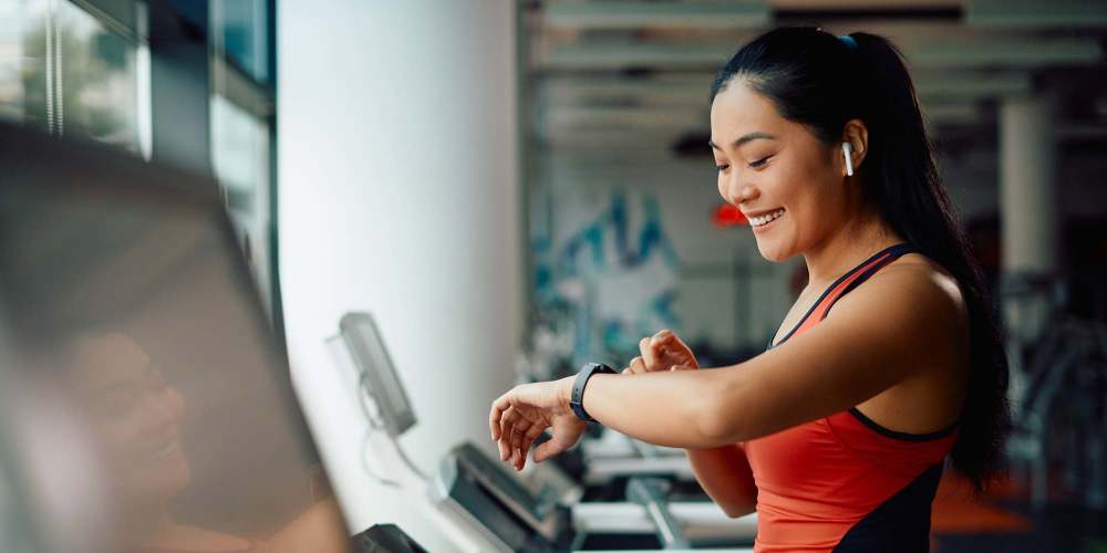 Woman working out in the gym at Groves at Town Center in Fletcher, North Carolina