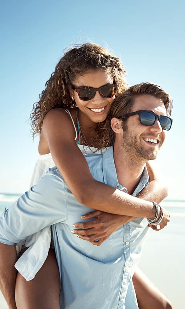 A couple enjoying the beach near Huntington Place