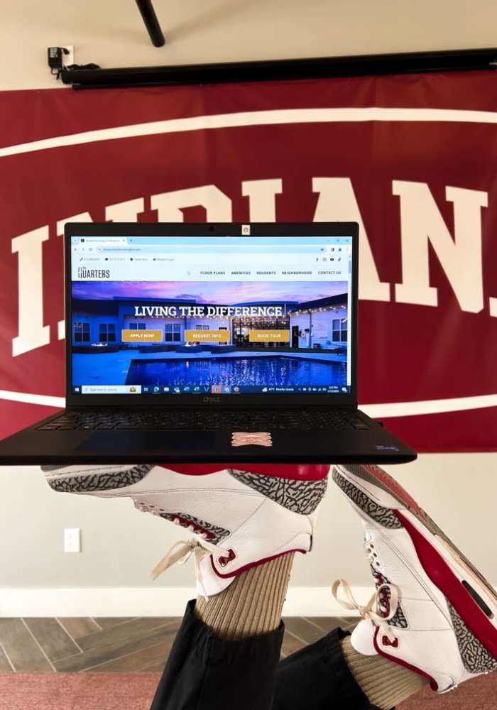 Laptop with The Quarters at Bloomington website on display at The Quarters at Bloomington in Bloomington, Indiana