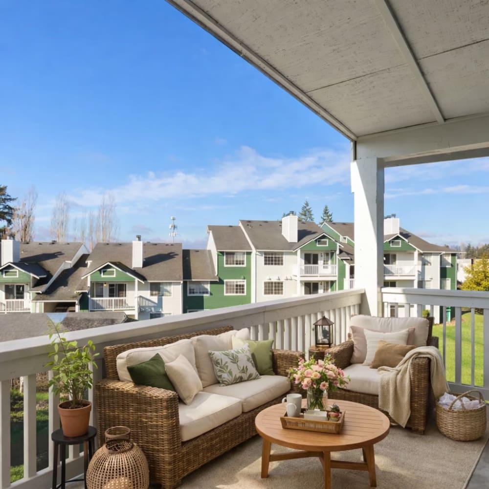 Indoor swimming pool featuring comfortable lounge seating for relaxation at Terravista in Tacoma, Washington