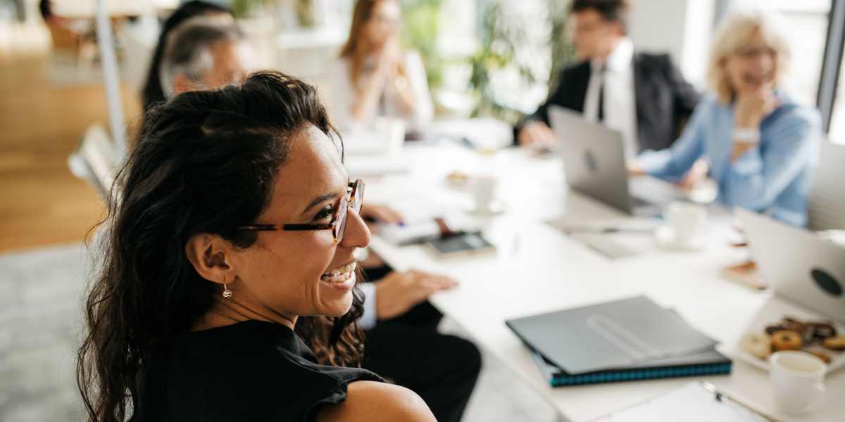 Team member smiling at SunRidge Management Group in Dallas, Texas