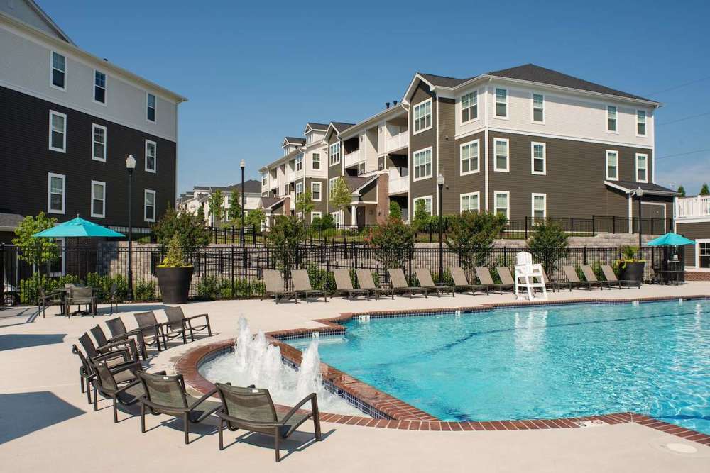 Pool area with lounge seating at  The Elms at Signal Hill Station in Manassas, Virginia