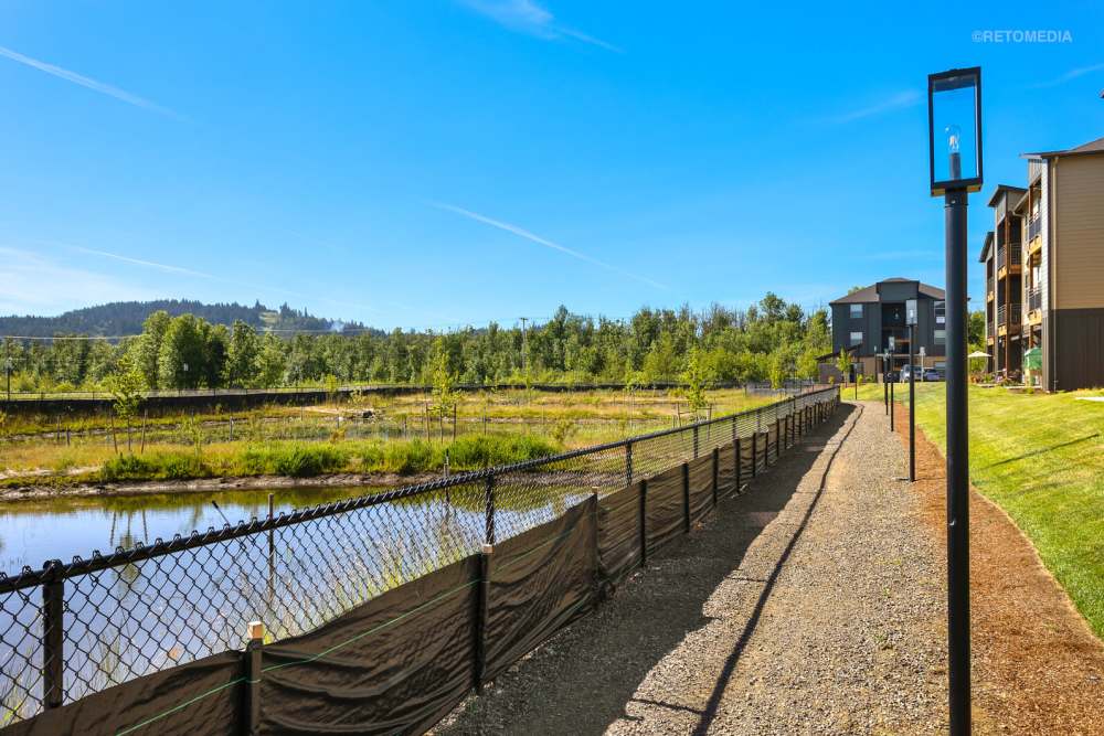 Walkway of Reserve at Hunters Ridge, with a parking lot in Eugene, Oregon