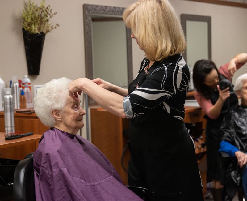 A resident getting her hair cut at Aurora on France in Edina, Minnesota. 