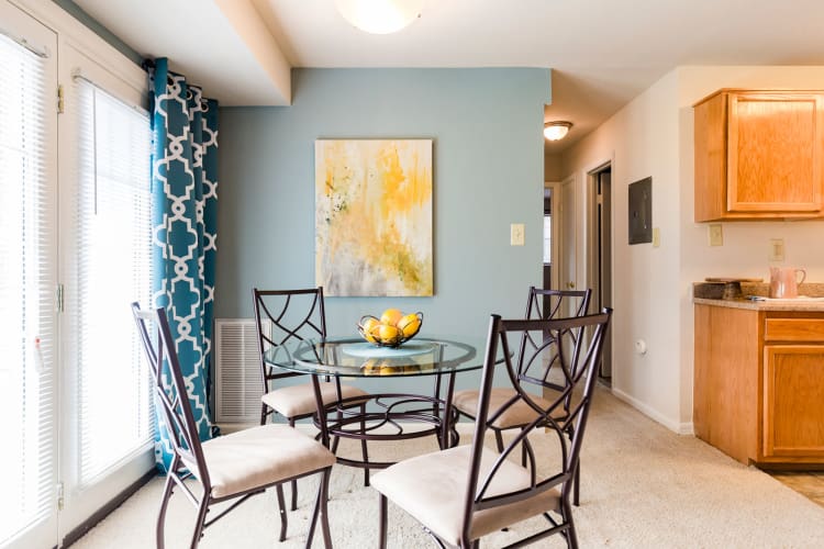Dining nook next to french doors that open to private patio in model home at Westgate Apartments & Townhomes in Manassas, Virginia