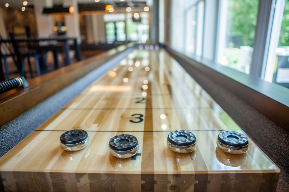 Shuffleboard table in the resident lounge at Boulders Lakeside in North Chesterfield, Virginia