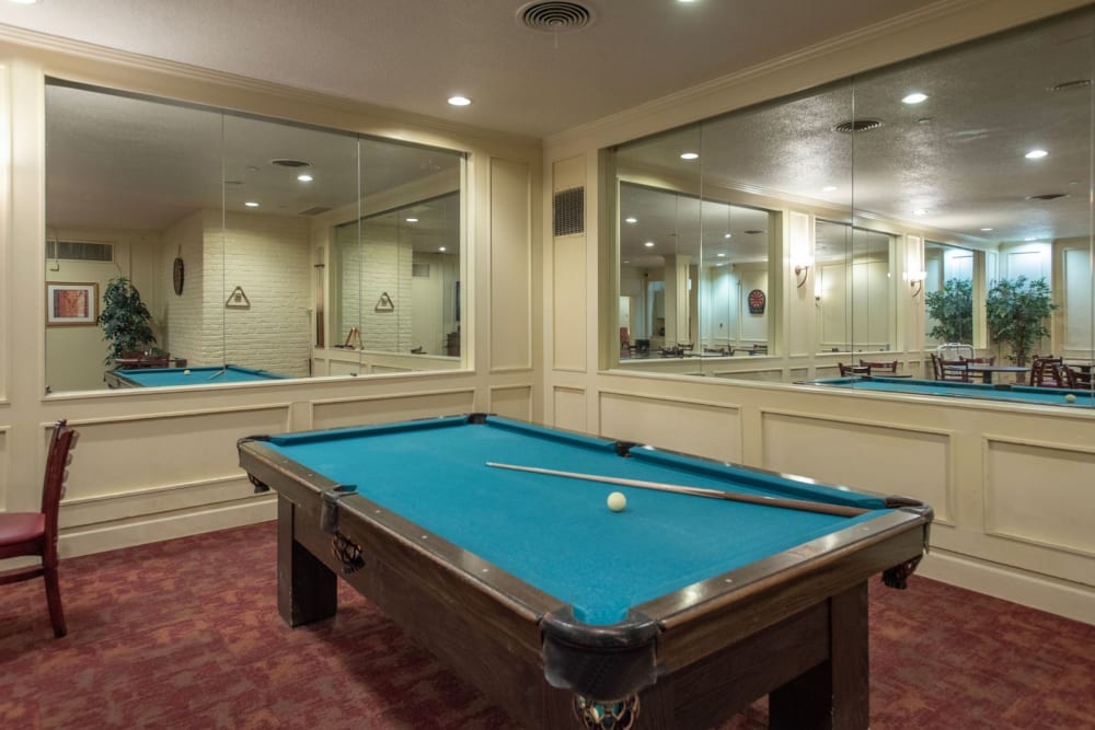 Game area with pool table at Park Place Senior Living in Sacramento, California