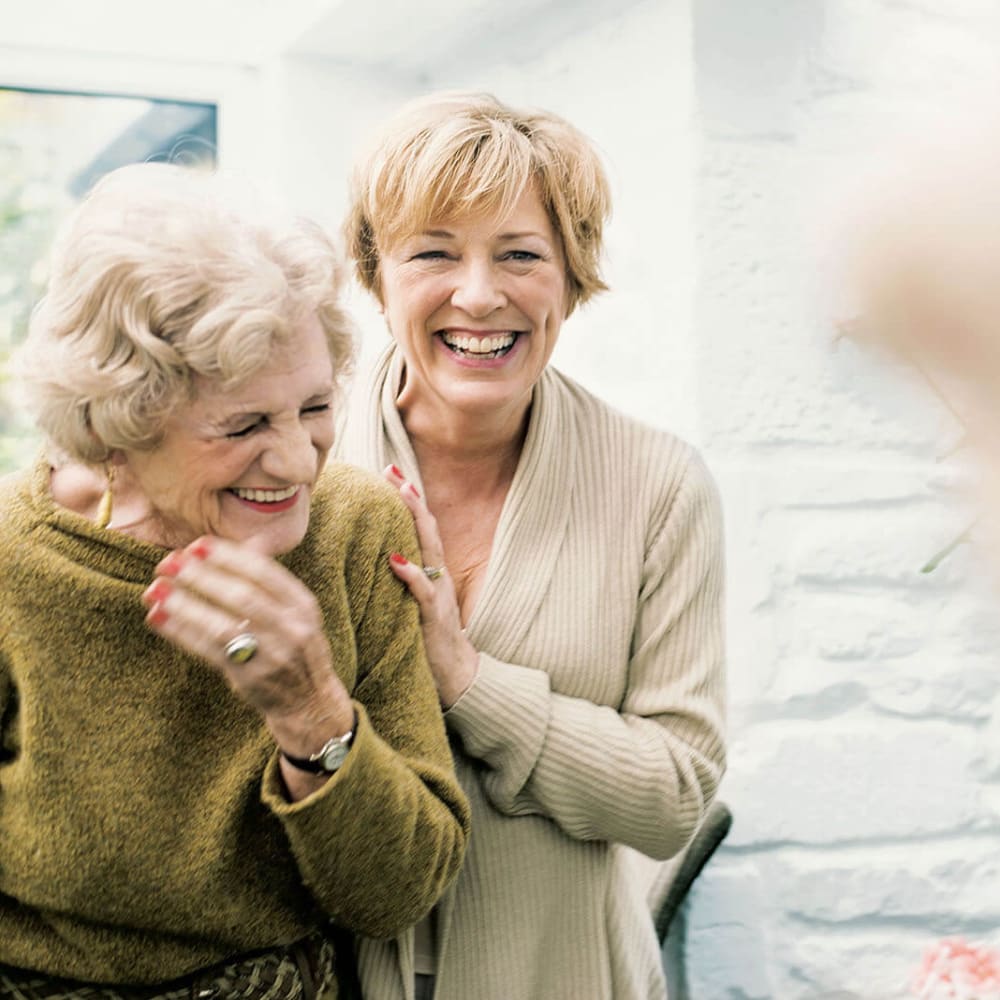 Two residents posing for a photo at Anthology of Wheaton in Wheaton, Illinois