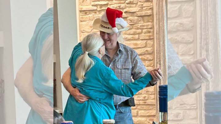 Residents dancing and smiling during a Christmas celebration at The Landing at Woodland Lakes in Conroe, Texas, sharing a sweet moment.