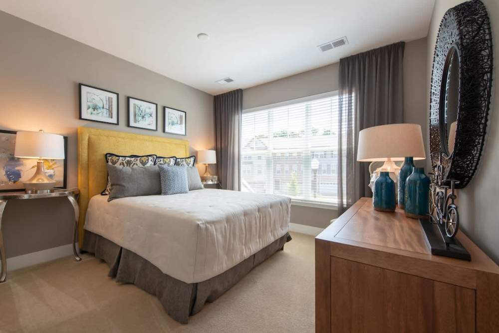 Bedroom with windows for lighting at The Elms at Signal Hill Station in Manassas, Virginia