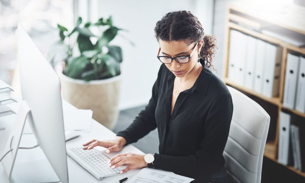 Resident hard at work at her office near Pleasanton Place Apartment Homes in Pleasanton, California