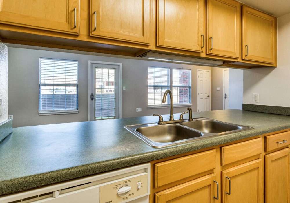 Kitchen with dishwasher at Boomer Creek Apartments in Stillwater, Oklahoma