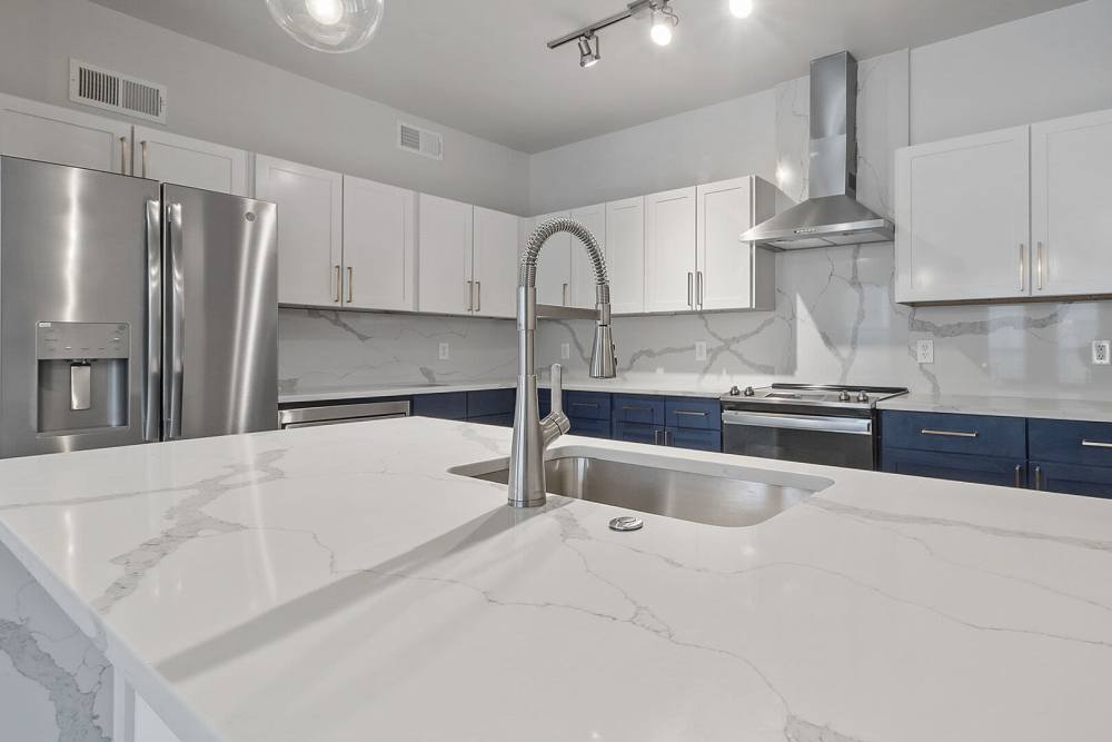 Granite countertop in the apartment kitchen at The Lofts At West 7th in Fort Worth,Texas