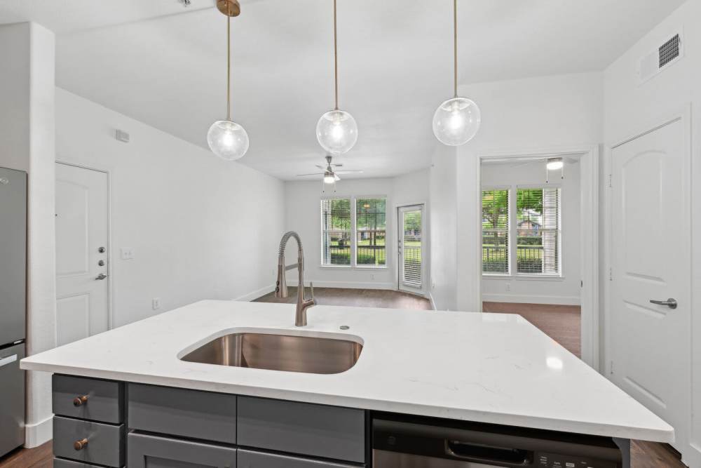Kitchen with granite countertops with proper lighting at Barron Park in Pearland, Texas