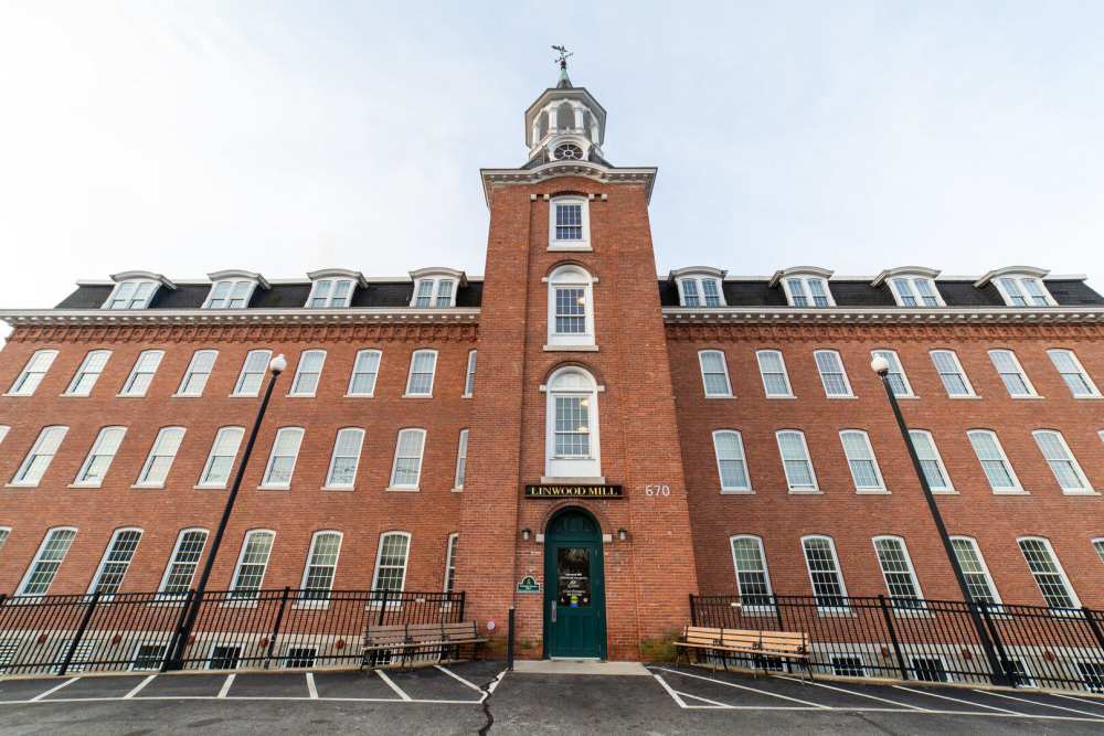 View of apartment building at Linwood Mill Apartments in Whitinsville. MA