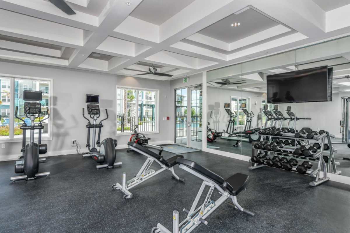 Well-equipped fitness center at Champions Vue Apartments in Davenport, Florida
