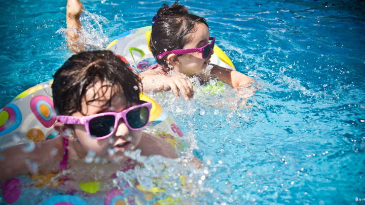 Children enjoying a day in the sun at a water park near Olympus Sierra Pines in The Woodlands, Texas