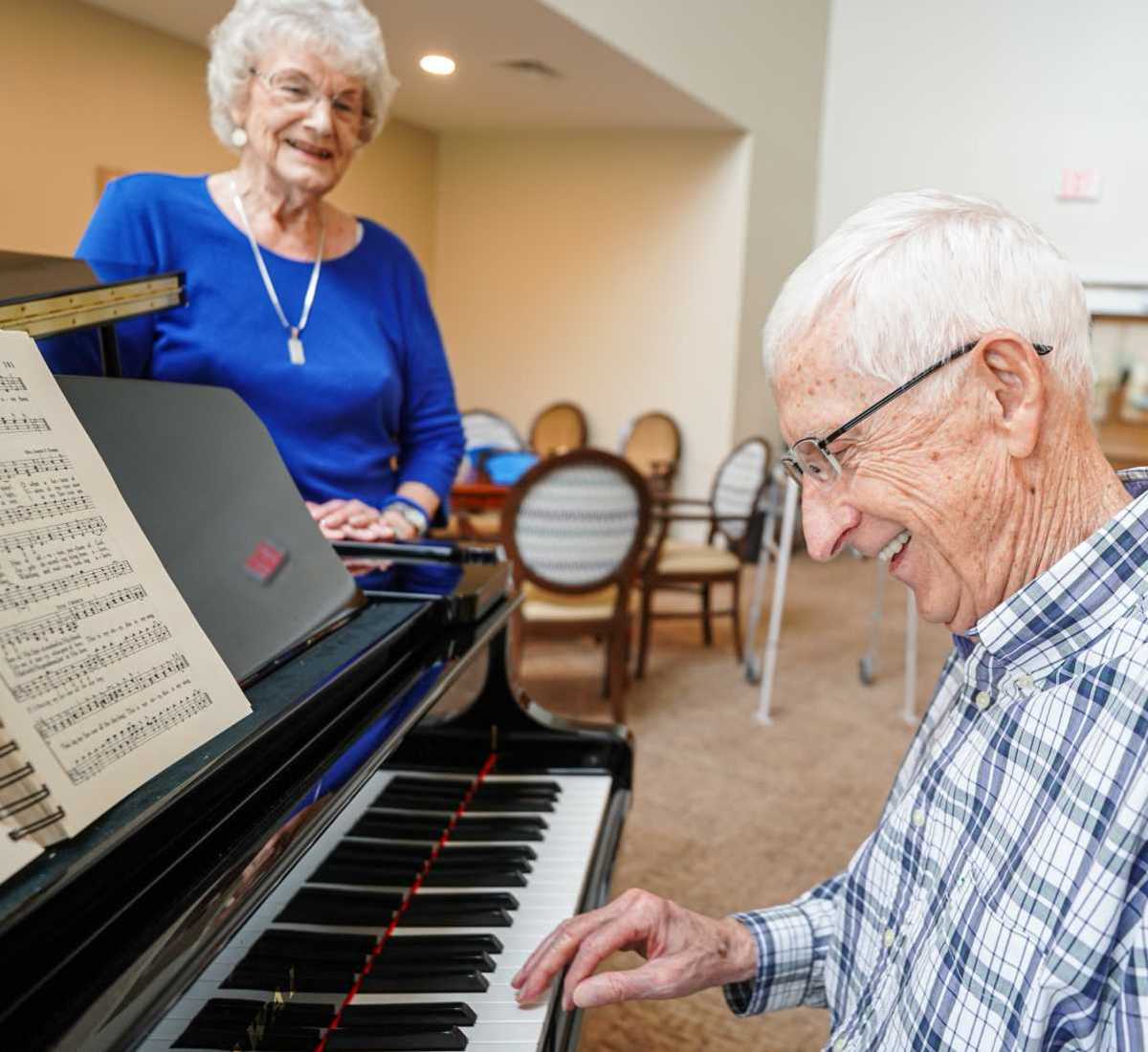 Resident playing piano at Harmony at Morning Grove in Memphis, Tennessee
