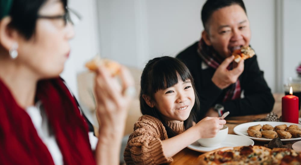 Resident family eating dinner at Pepperwood in Davis, California