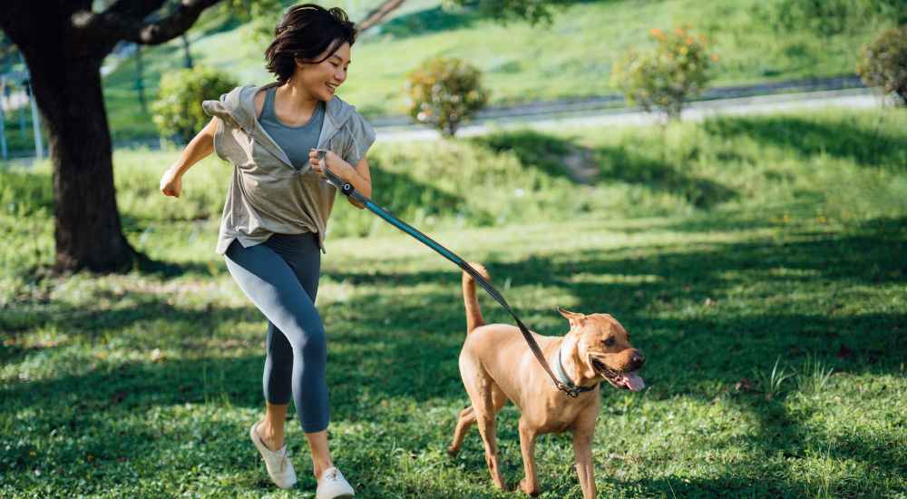 Woman taking her dog for a walk near 4315 S. Alder in Tacoma, Washington