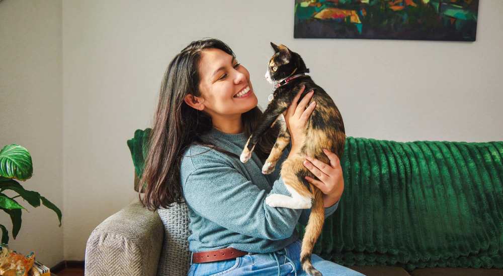 Happy cat with its resident at Blue Bell Village One in Houston, Texas