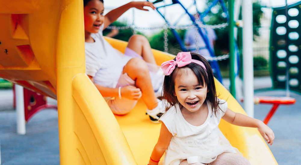 Kids playing in playground at The Meadows on Blue Bell in Houston, Texas