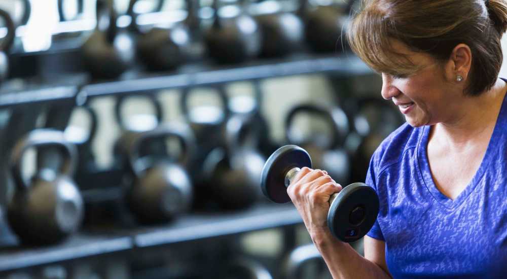 Resident working in a fitness center at Hollywood Plaza in Hollywood, California