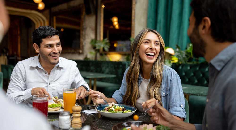 Residents having delicious food at a restaurant near Millennium Place in Corinth, Texas 