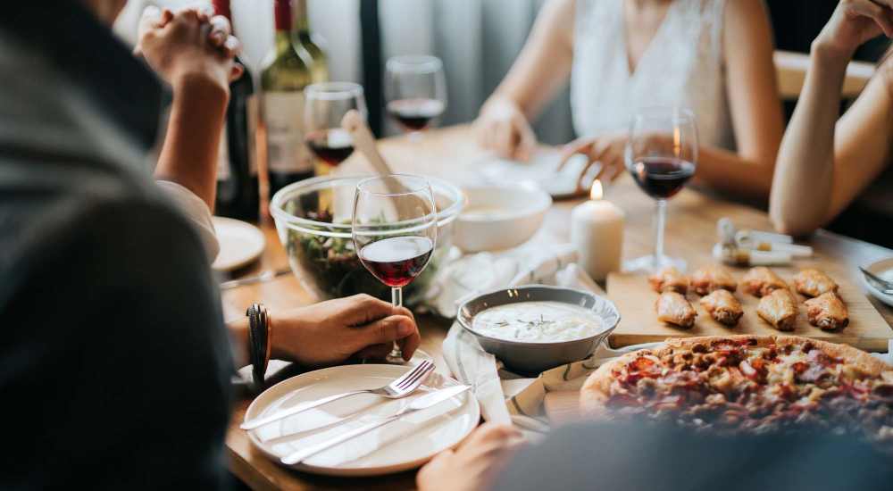 Residents enjoying food at a restaurant near Woodchase Apartments in San Leandro, California