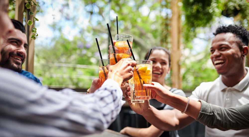 Residents having drinks at a restaurant near Stonebridge Apartment Homes in Lufkin, Texas